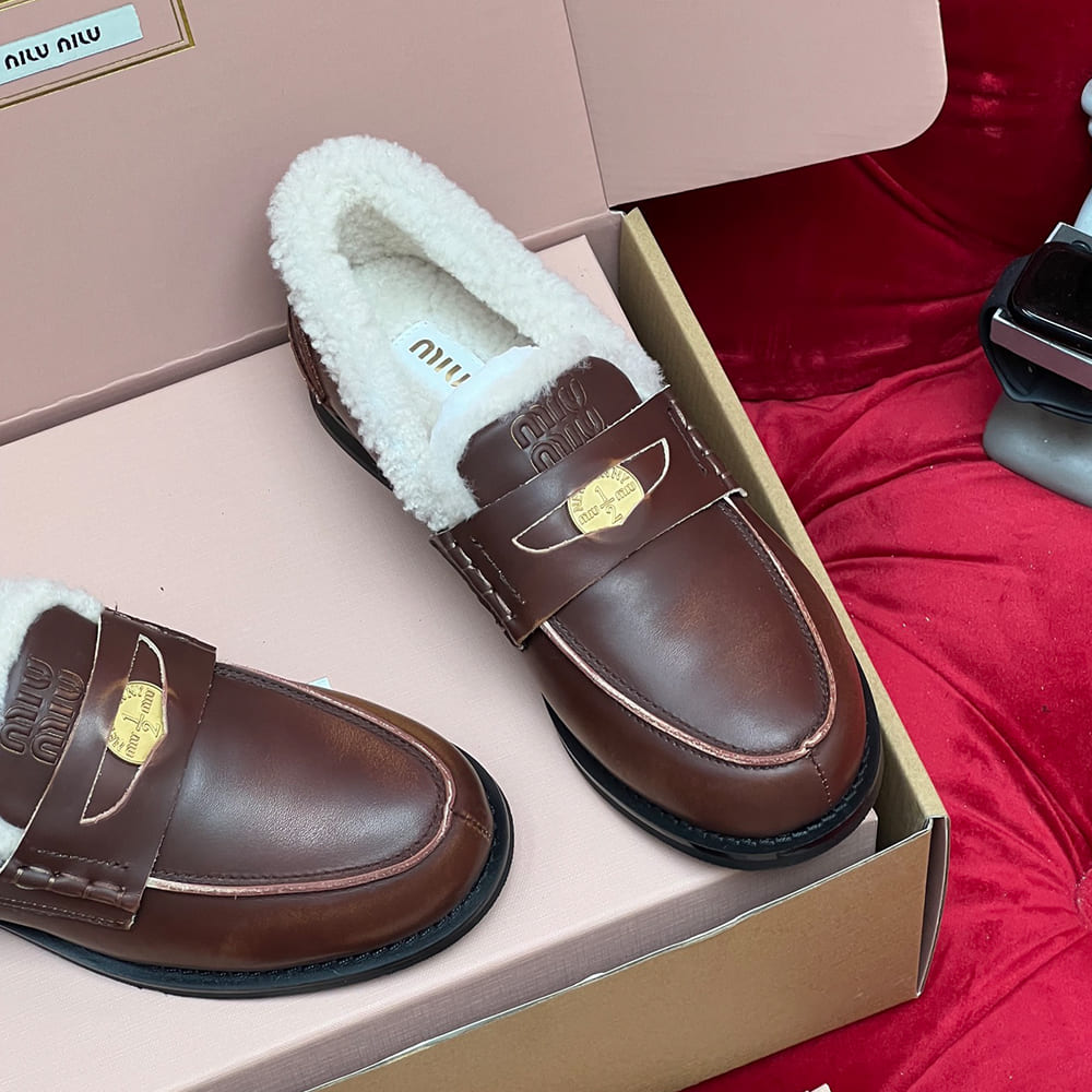 M1um1u Bleached leather and shearling penny loafers